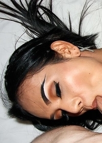 Khawn bends over and spreads her ass-pussy wide and heads over to a chair in the corner to get a little more comfortable. She strokes her hole a littl