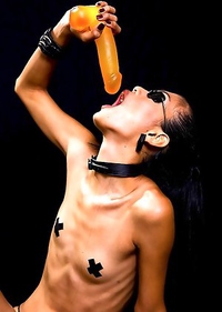 Tight Ladyboy Karn asshole teases by a giant yellow dildo