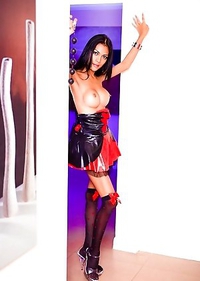 Ladyboy Rose ready for pleasure with a paddle and anal beads