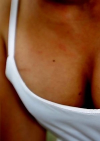 21yo busty Thai shemale Bam does a striptease for the camera