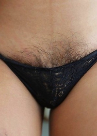 21yo busty Thai shemale Bam does a striptease for the camera